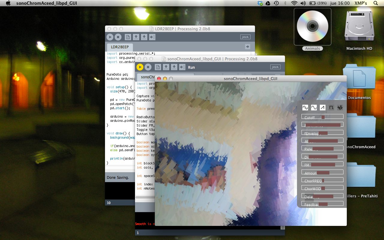 A 2013 Mac desktop running sonoChromAceed, a Processing sketch showing a camera feed crushed into cubist pixels beside synth sliders, with Processing code and an Arduino sketch open behind it